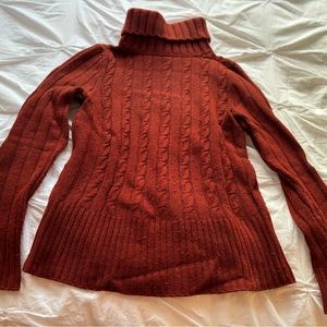 Coziest turtleneck sweater in rich brick red